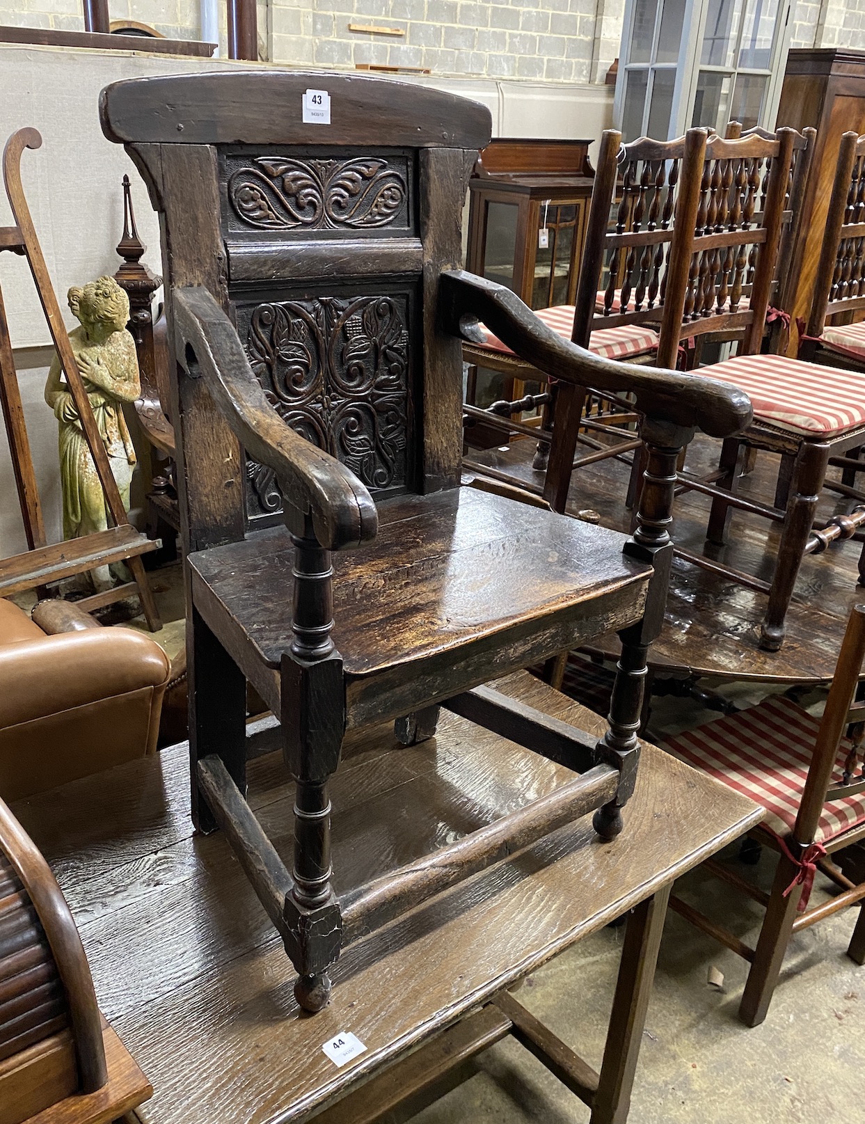 A 17th century and later oak carved Wainscot chair, width 57cm, depth 51cm, height 99cm